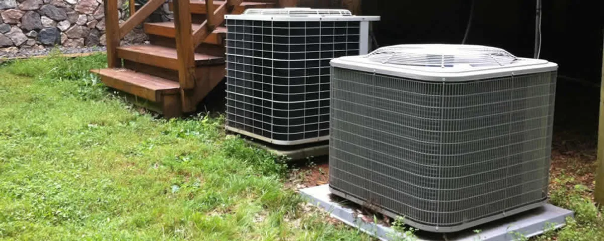 Heat pump installation and service units outside a home in Mansfield, MA