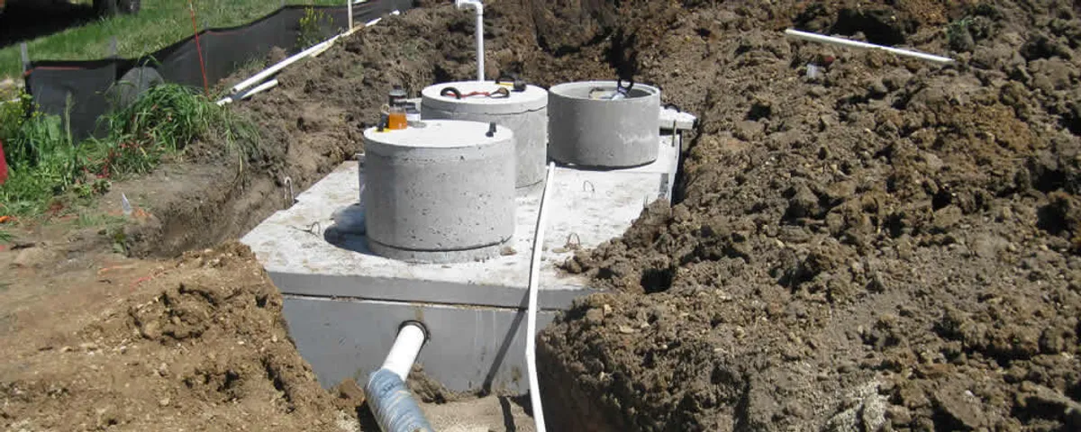 Septic system repair and installation site with tank access ports in Mansfield, MA